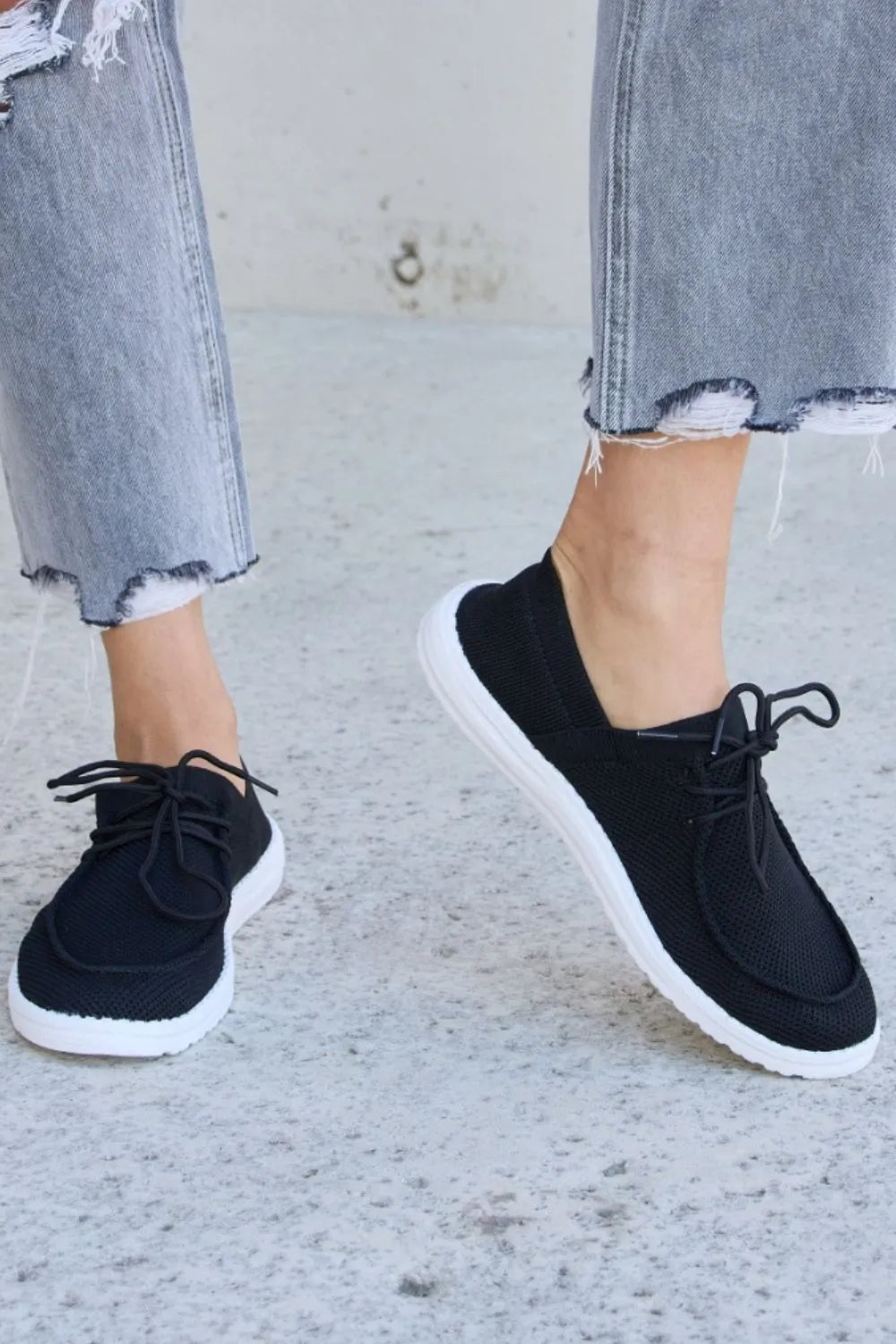 Black Trendsi Forever Link flat round toe lace-up sneakers with stylish design and comfortable fit.