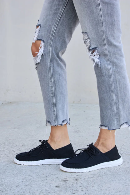 Black Trendi Forever Link flat round toe lace-up sneakers with white sole and stylish design, perfect for casual wear.