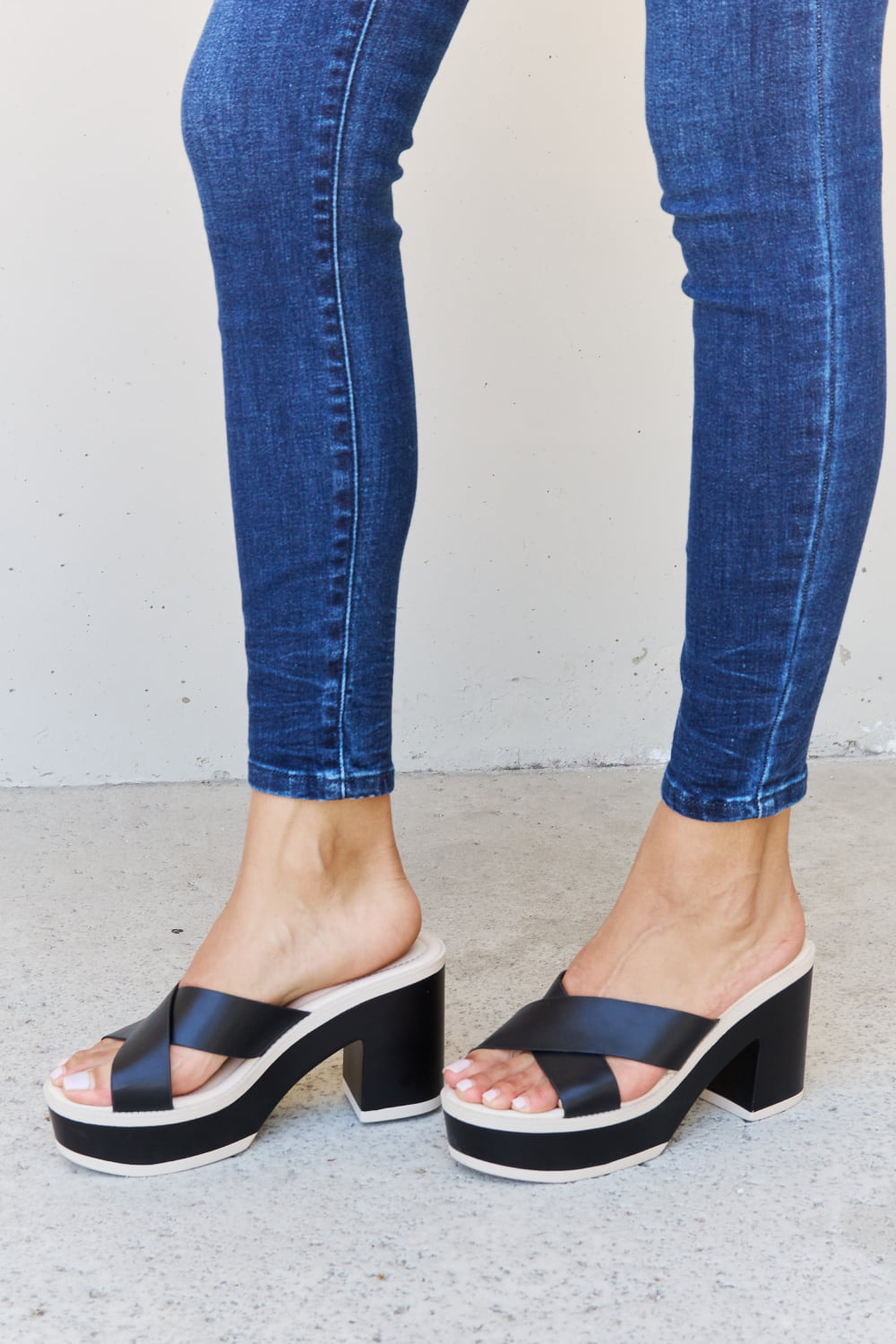 Black Weeboo Cherish The Moments contrast platform sandals by Trendsi with thick sole and stylish design for casual wear.