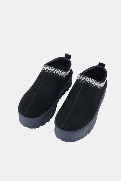 Black Weeboo platform slip-on boots with embroidered trim, stylish and comfortable footwear by Trendsi.