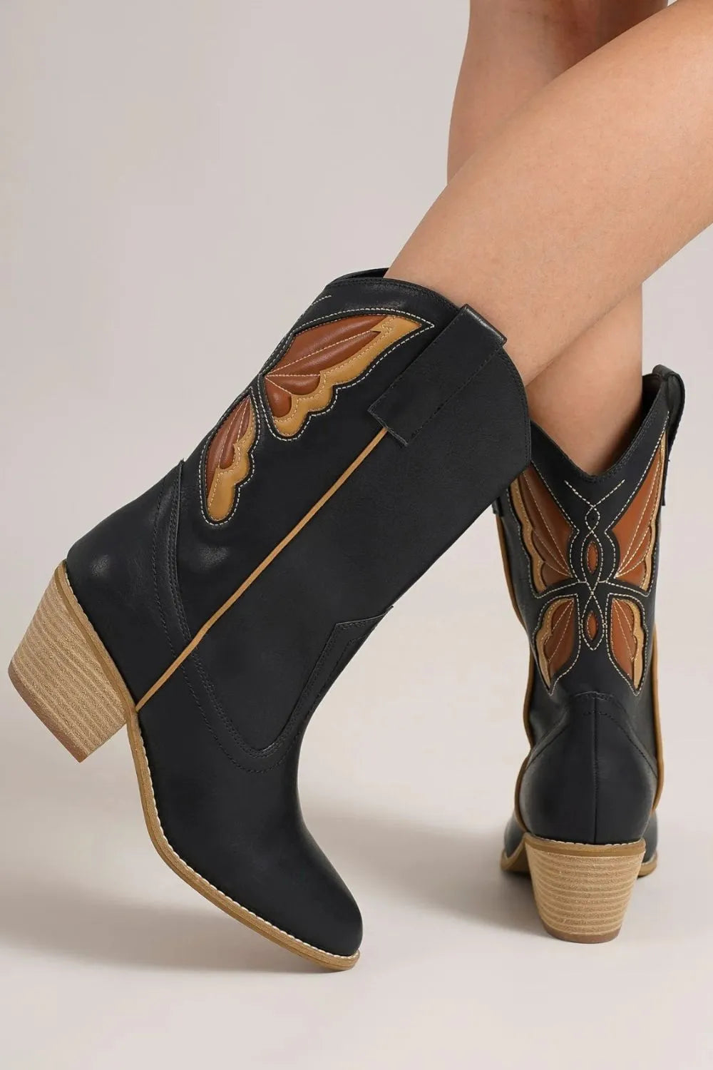 Black Beast Fashion butterfly cut detail point toe boots with sleek design and stylish cutouts, perfect for trendy footwear.