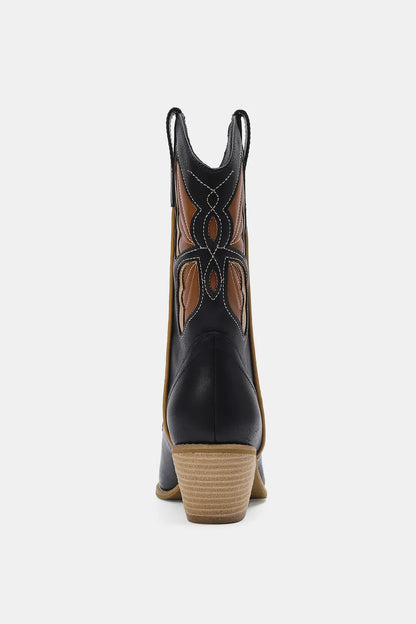Black Butterfly Cut Detail Point Toe Boots by Trendsi featuring sleek design and fashionable cut-out accents.