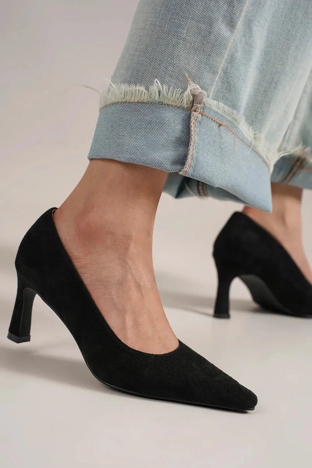 Black faux suede point toe pumps by Beast Fashion featuring a sleek design and stiletto heel, perfect for stylish occasions.