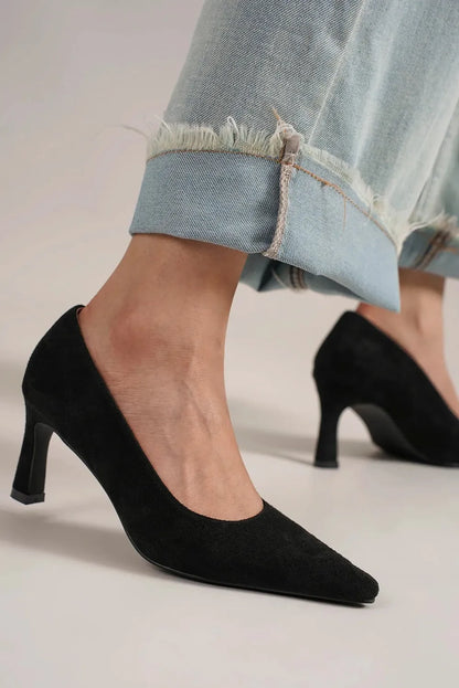 Black faux suede point toe pumps by Beast Fashion featuring a sleek design and stiletto heel, perfect for stylish occasions.