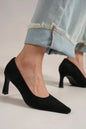 Black faux suede point toe pumps by Beast Fashion featuring a sleek design and stiletto heel, perfect for stylish occasions.
