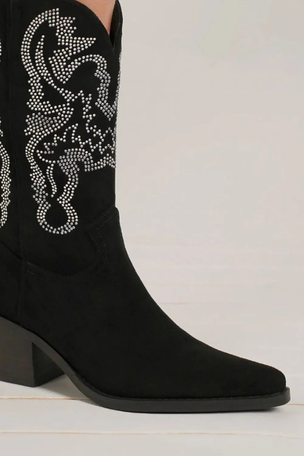 Black Beast Fashion rhinestone detail point toe boots with sleek design and stylish embellishments.