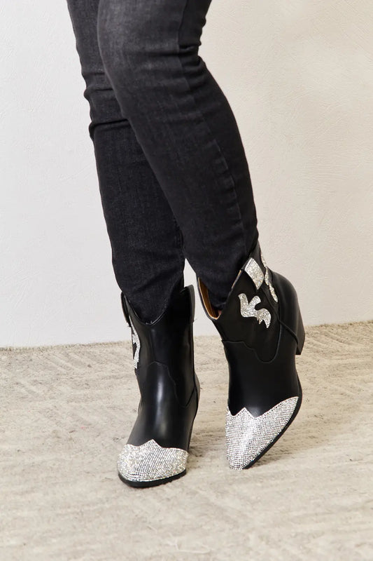 Black East Lion Corp rhinestone pointed boots with stiletto heels and decorative rhinestone details, stylish footwear by Trendsi.