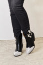 Black East Lion Corp rhinestone pointed boots with stiletto heels and decorative rhinestone details, stylish footwear by Trendsi.