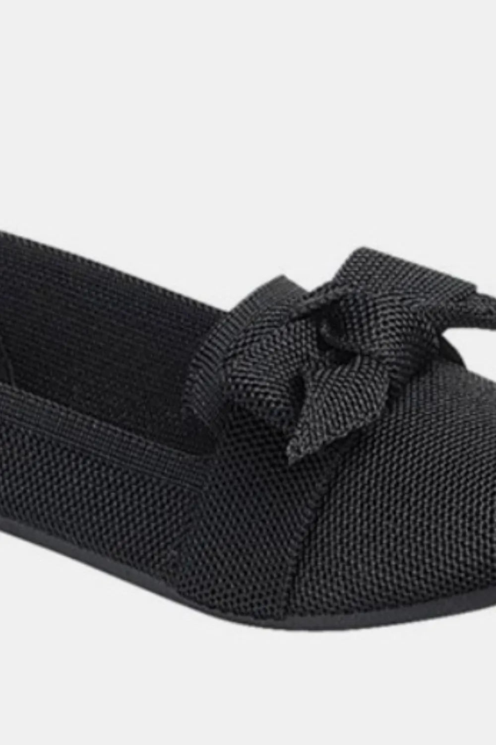 Black Trendsi Forever Link bow tie slip-on ballet flats with a sleek design and comfortable fit.