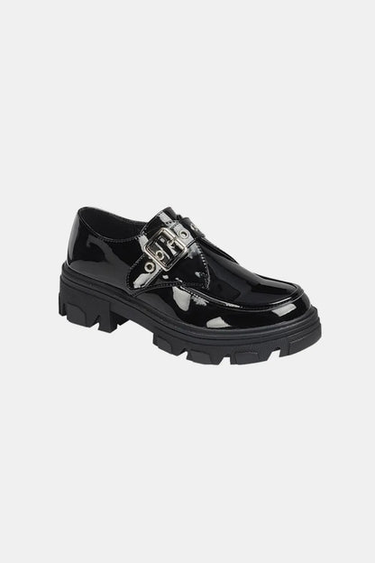 Black Forever Link Buckled Platform Lug Sole Loafers by Trendsi, showing the stylish loafers with buckle details and chunky lug soles.