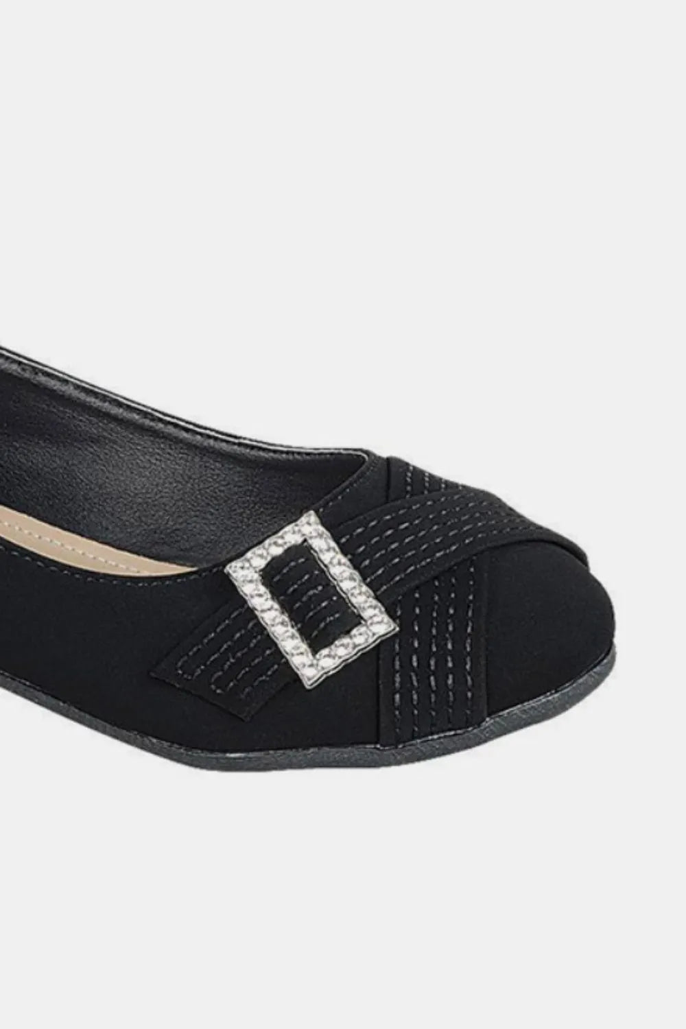 Black Forever Link slip-on ballet flats with rhinestone buckle detail, stylish and comfortable for everyday wear.