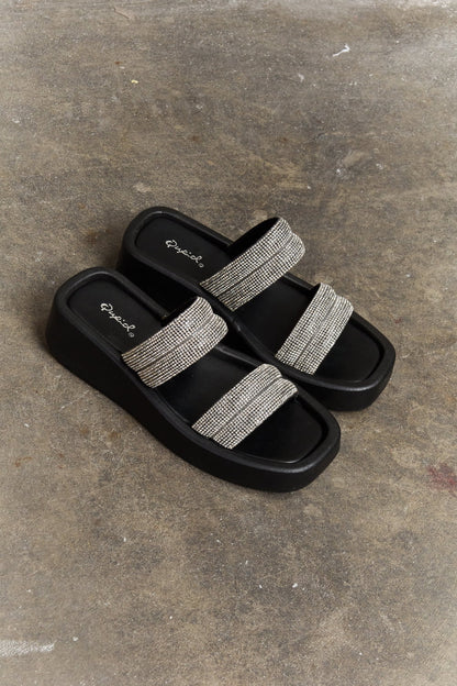 Black Qupid Bright Mind platform wedge sandal with rhinestone embellishments, stylish open-toe design, and ankle strap.