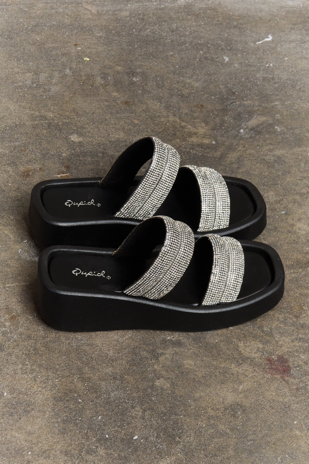 Black Qupid Bright Mind platform wedge sandal with rhinestone embellishments, featuring a trendy open-toe design and ankle strap.