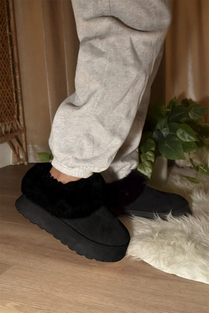 Black WILD DIVA faux-fur platform slip-on booties by Trendsi, featuring a stylish slip-on design with plush faux fur accents.