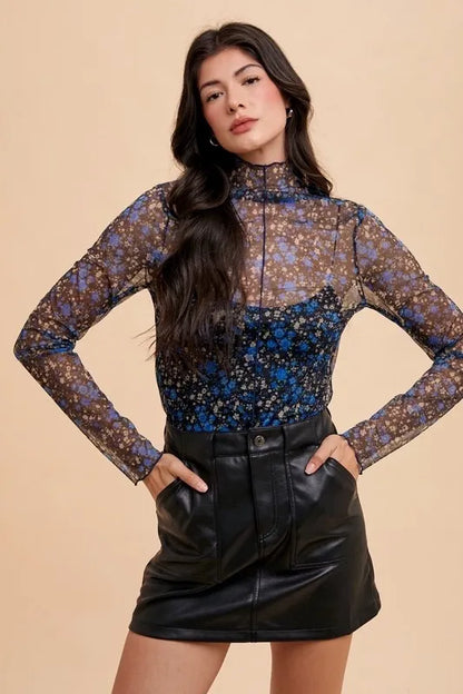 Black and blue floral sheer mesh top with lettuce hem by Annie Wear, featuring a lightweight, stylish design.