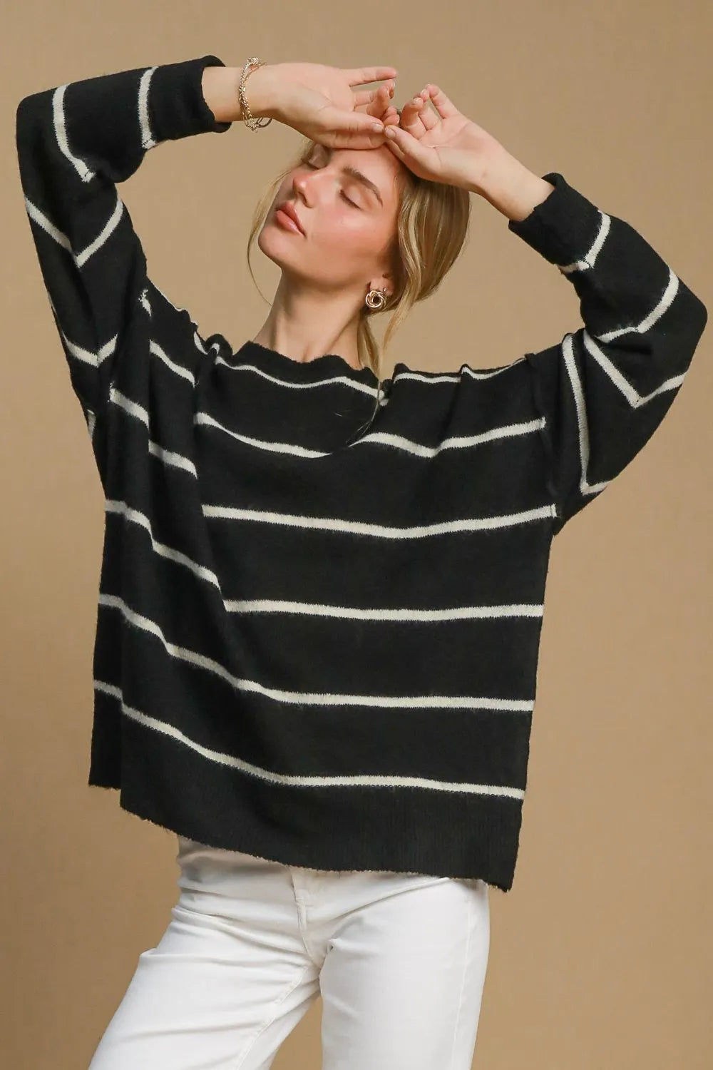 Black and cream wool blend striped round neck sweater by Umgee, featuring a cozy, casual fit and classic pattern.