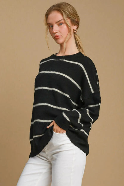 Black and cream striped wool blend sweater with round neckline by Umgee, styled for a cozy, casual look.