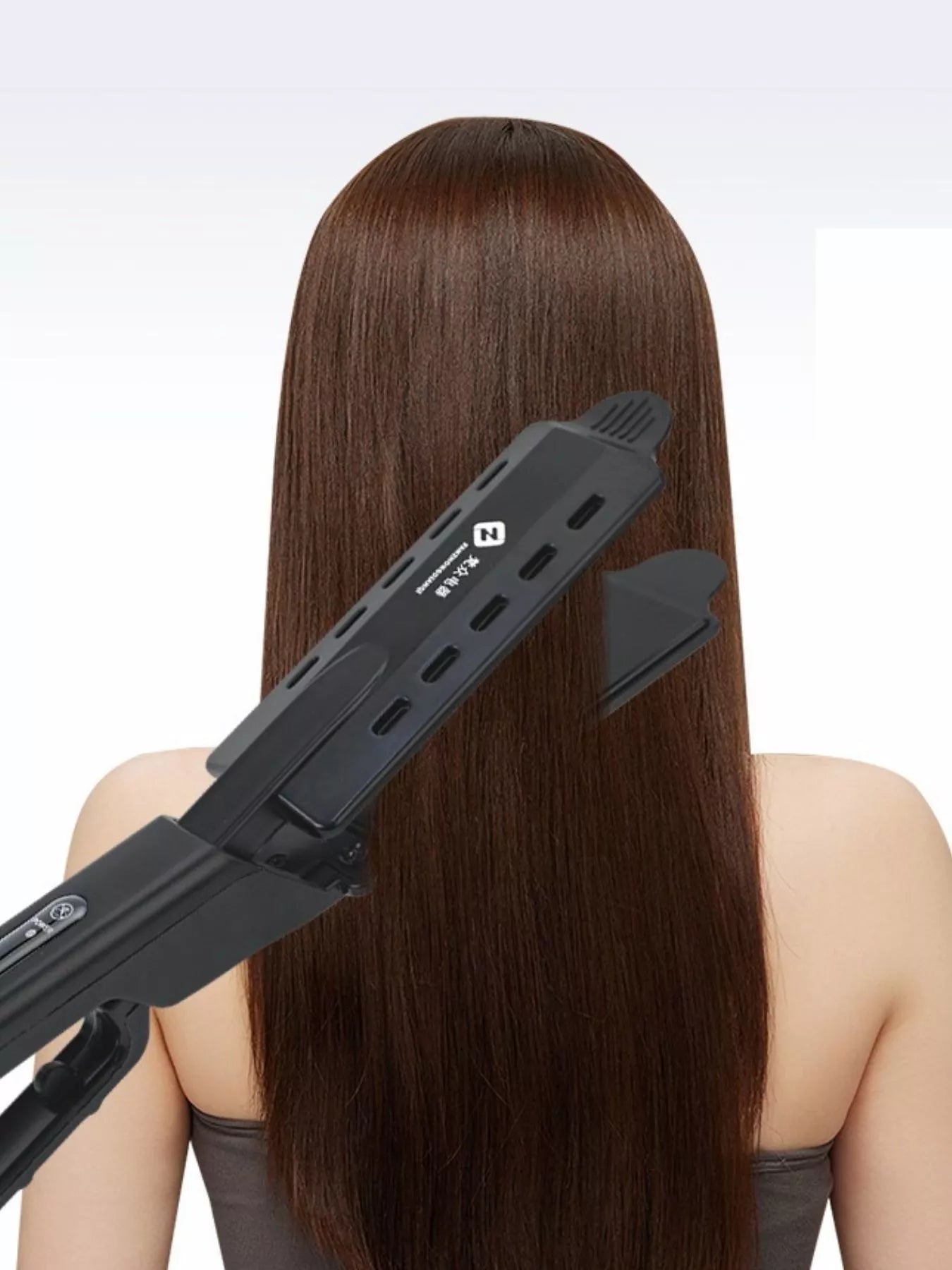 Black adjustable temperature hair straightener by Trendsi with European plug, sleek design, and ceramic plates for smooth styling.