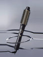 Black Trendsi fast heating hot air brush with European plug for quick styling and smooth, shiny hair.