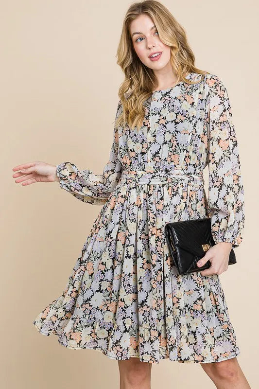 Black floral chiffon belted dress by Trendsi with lime and chili print, featuring back zipper and flowing silhouette.