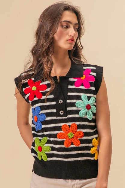Black and ivory striped sweater vest with floral patch details and half-button front, by Trendsi.