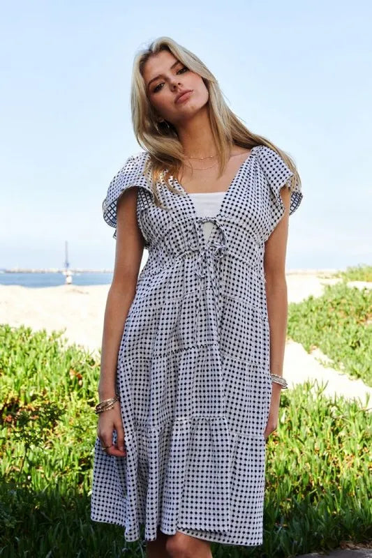 Black and ivory Davi & Dani jacquard V-neck flutter cap sleeve tiered dress, stylish and elegant for various occasions.