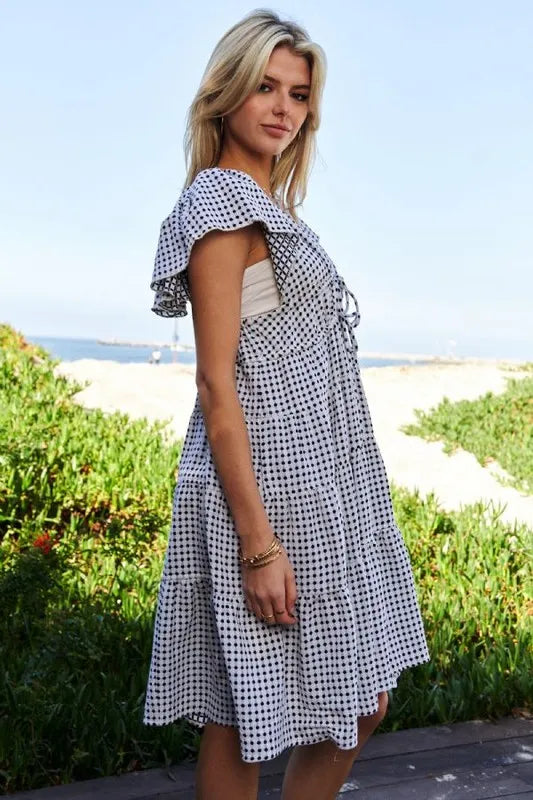 Black and ivory Davi & Dani jacquard V-neck flutter cap sleeve tiered dress, stylish and elegant for special occasions.