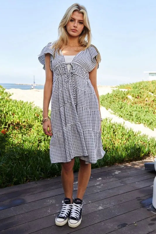 Black and ivory Davi & Dani jacquard V-neck flutter cap sleeve tiered dress, stylish and lightweight for warm weather.