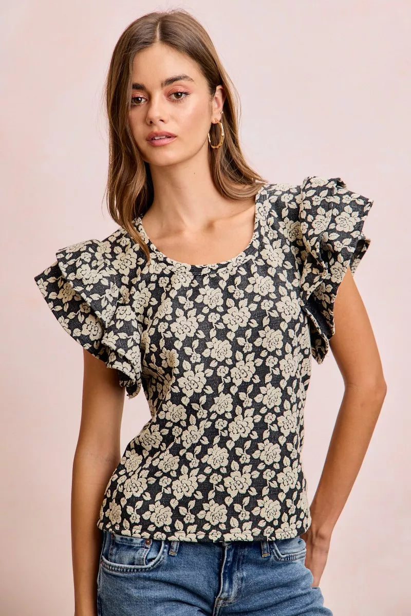 Black and light grey BiBi Floral Jacquard knit top with ruffle sleeves from Trendsi, featuring a stylish floral pattern.