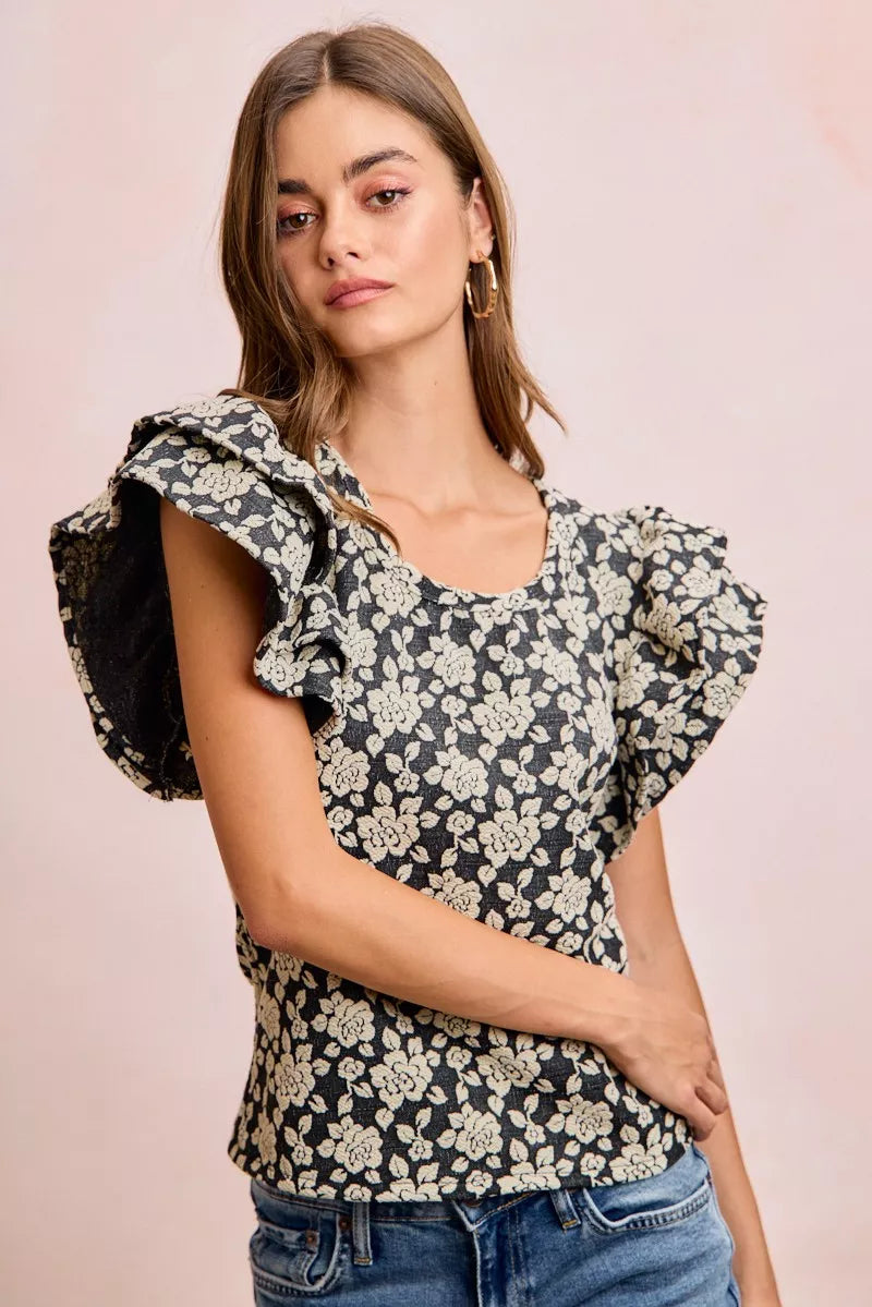 Black and light grey floral jacquard knit top with ruffle sleeves from Trendsi, featuring a stylish and textured design.