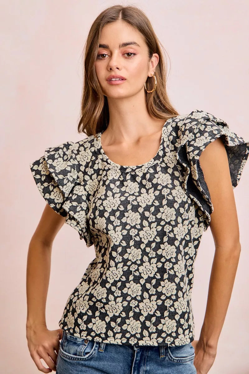 Black BiBi floral jacquard knit top with ruffle sleeves, stylish and cozy, from Trendsi.