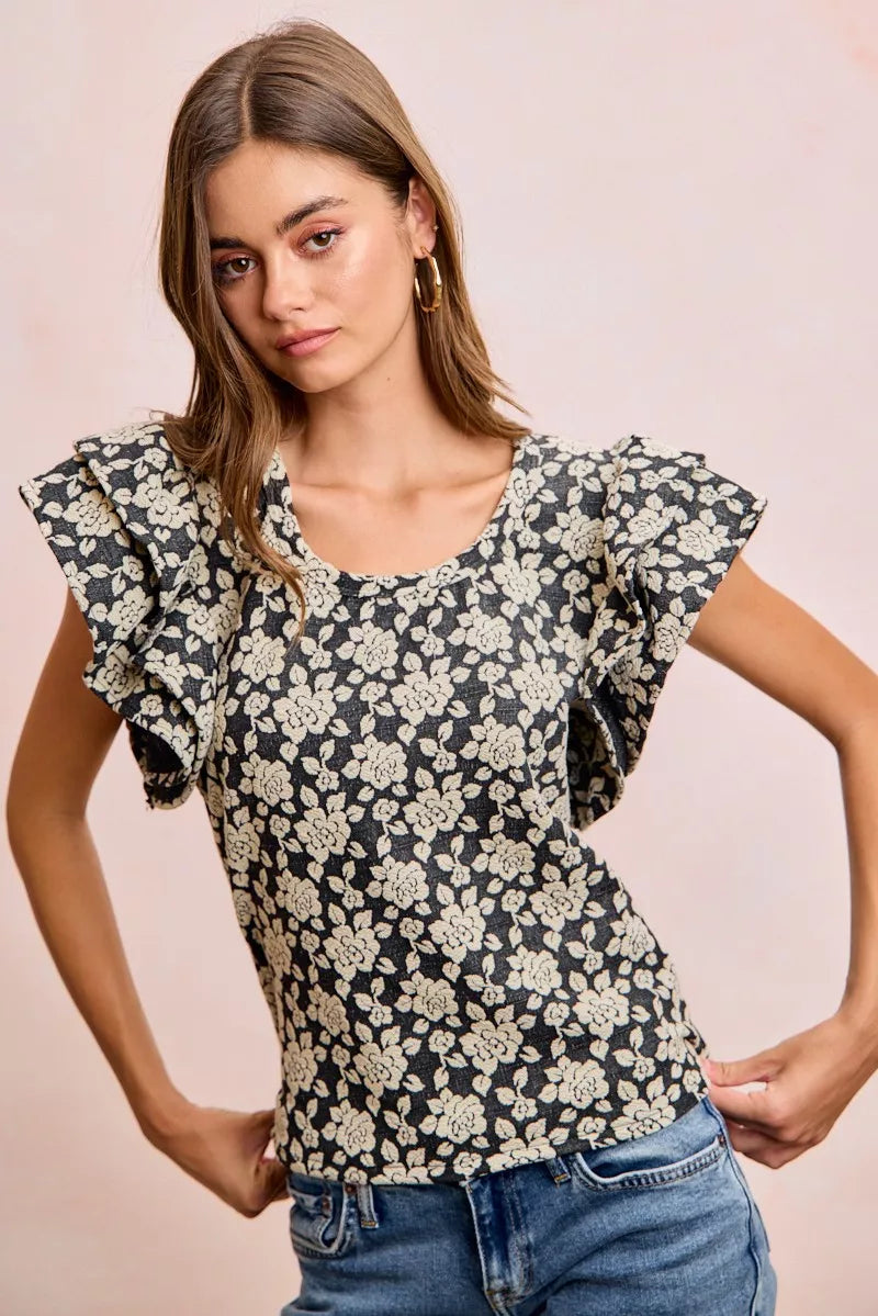 Black and light grey BiBi floral jacquard knit top with ruffle sleeves from Trendsi, featuring a stylish, textured pattern.