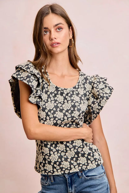 Black and light grey floral jacquard knit top with ruffle sleeves from Trendsi, featuring a stylish and cozy design.