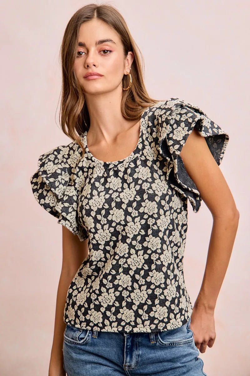 Black and light grey BiBi floral jacquard knit top with ruffle sleeves, featuring a stylish and textured design.