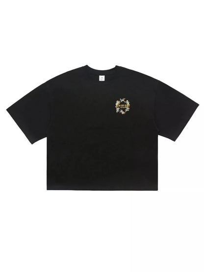 Black men's graphic round neck short sleeve T-shirt from Trendsi, featuring a bold graphic design on the front.