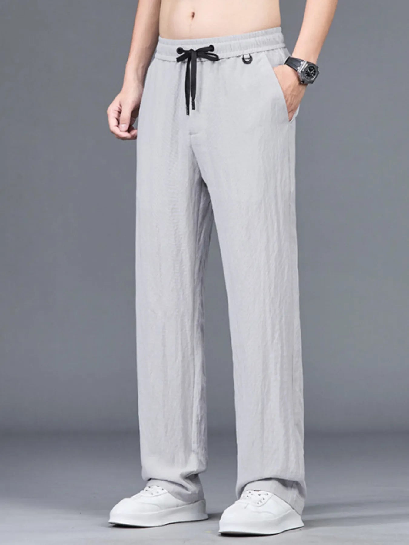 Black men's plus size lightweight casual pants from Trendsi, featuring a relaxed fit and comfortable fabric for everyday wear.
