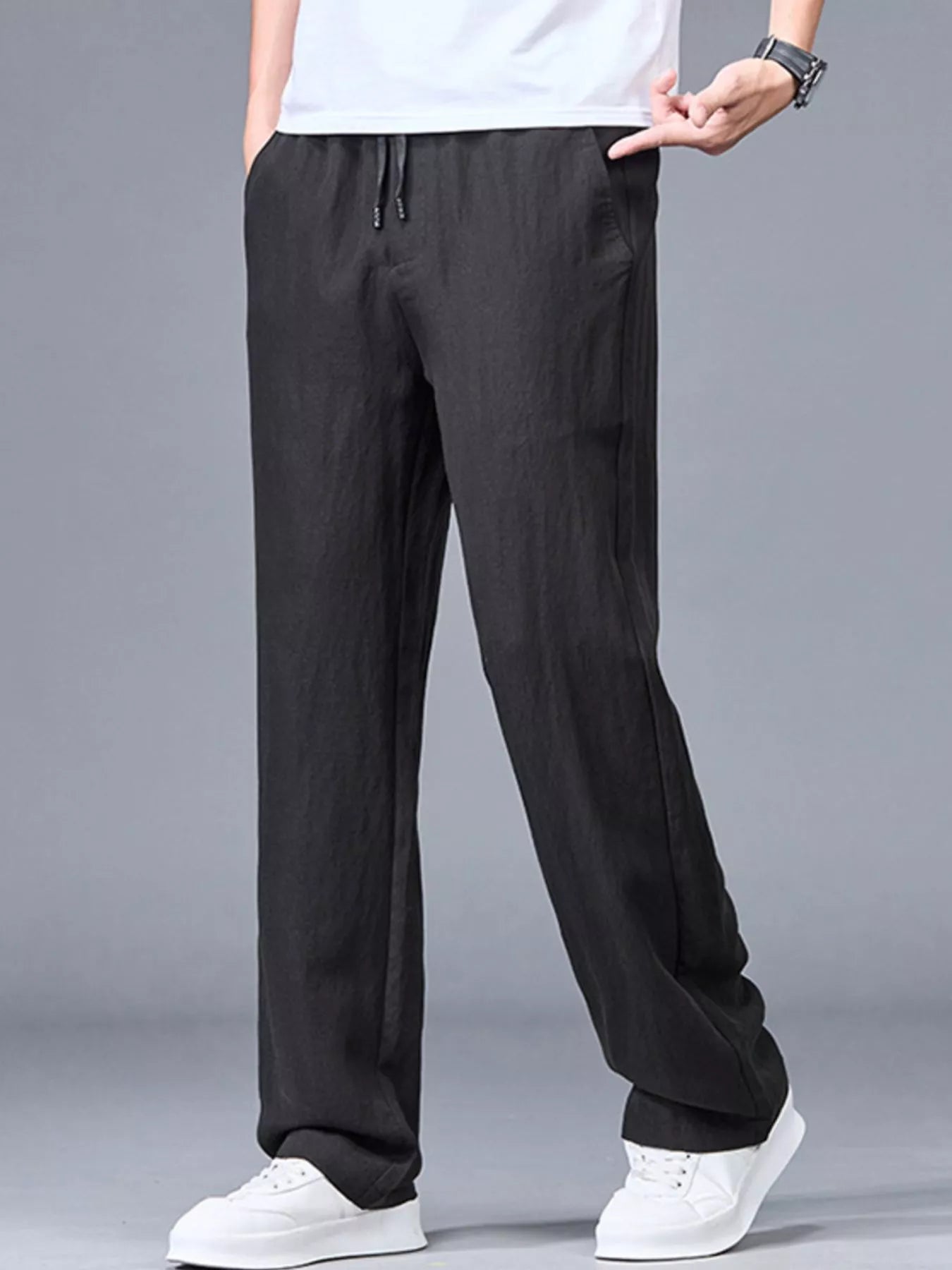 Men's plus size lightweight casual pants in black from Trendsi, featuring a comfortable fit and relaxed style.