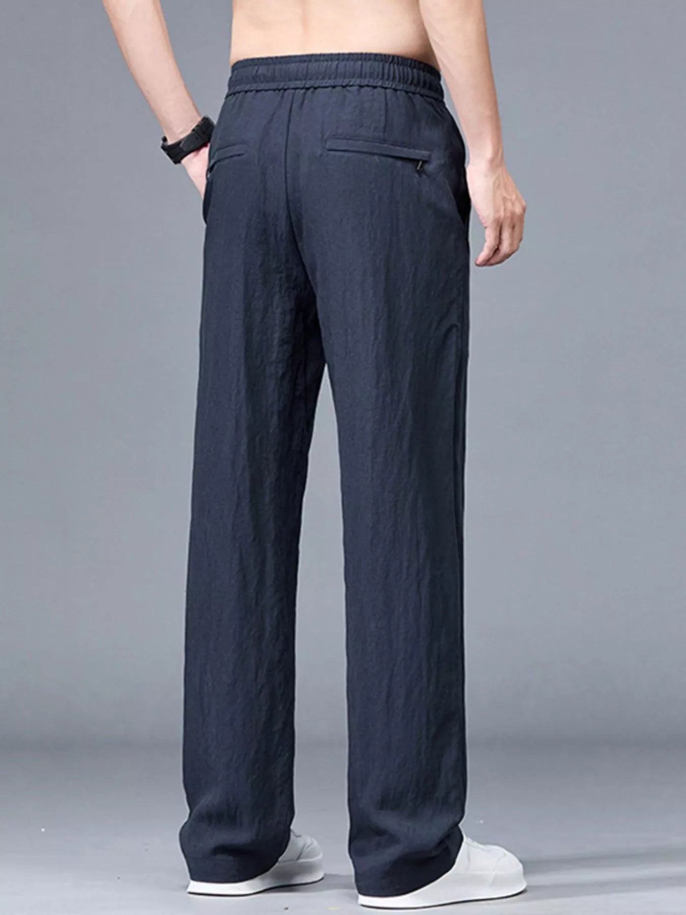 Men's plus size lightweight casual pants in black from Trendsi, shown on model, comfortable fit and relaxed style.