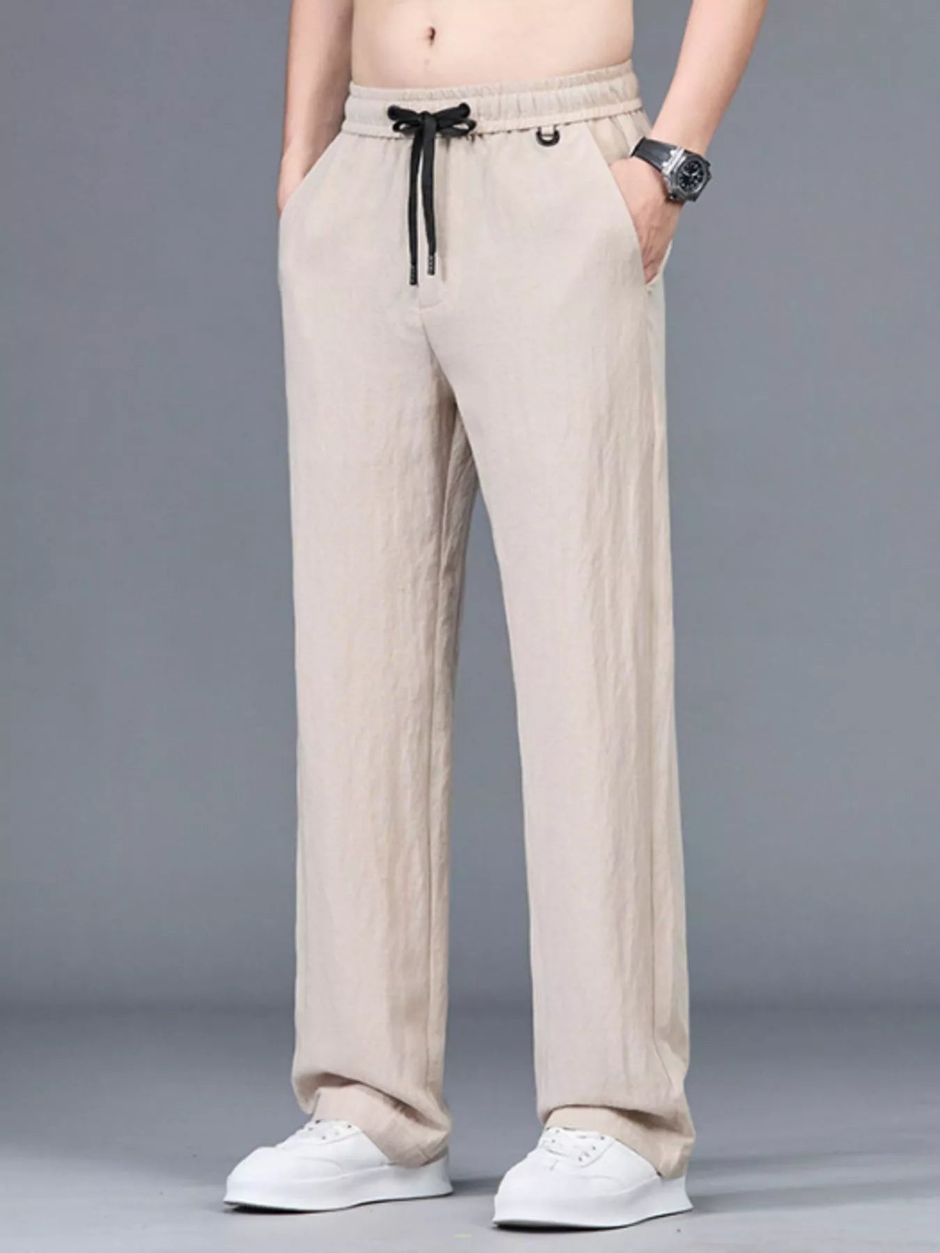 Men's plus size lightweight casual pants in black, featuring a relaxed fit and comfortable design by Trendsi.