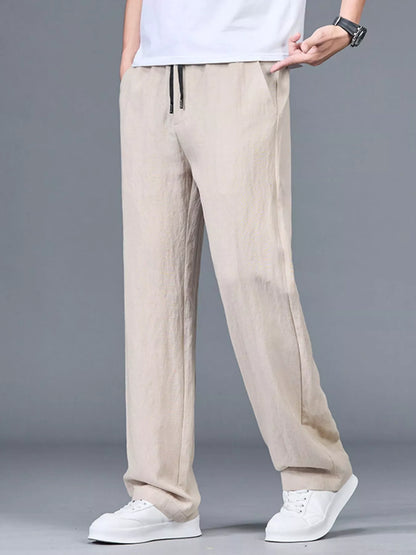 Men's plus size lightweight casual pants in black from Trendsi, featuring a relaxed fit and comfortable fabric.