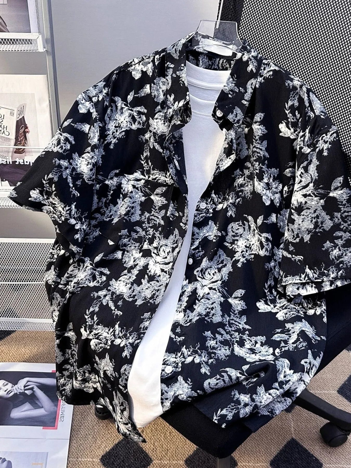 Plus size men's printed short sleeve button-up shirt by Trendsi in black, featuring a vibrant, stylish print and classic collar.