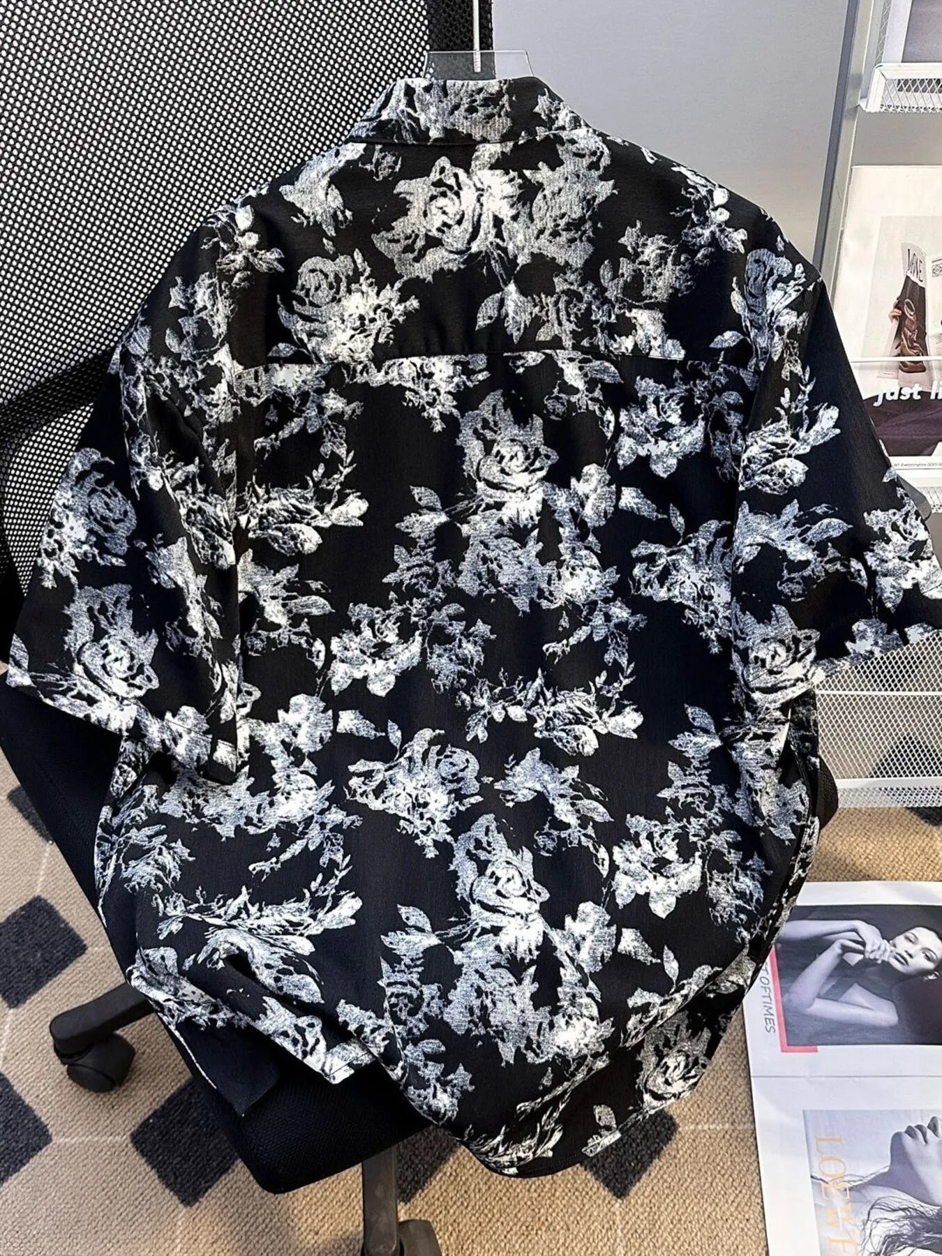 Men's plus size printed button-up short sleeve shirt by Trendsi, black with colorful abstract pattern, lightweight and casual fit.
