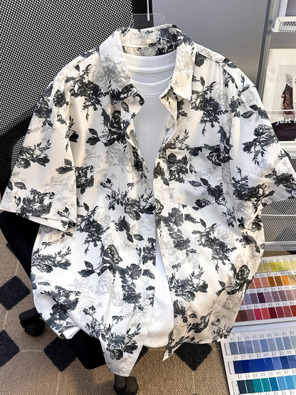 Plus size men's printed short sleeve button-up shirt by Trendsi, black fabric with colorful pattern, casual summer style.