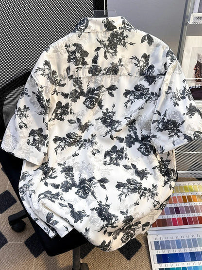 Men's plus size printed short sleeve button-up shirt in black by Trendsi, featuring a stylish pattern and comfortable fit.