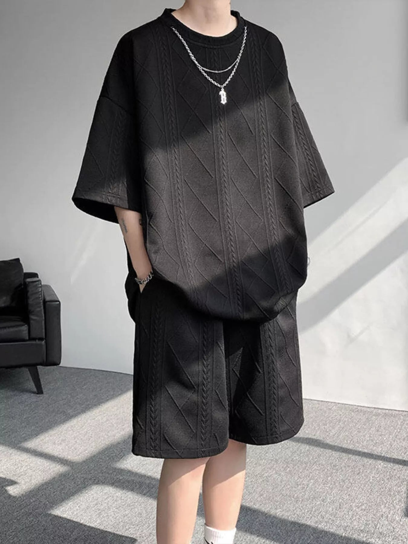 Men's plus size textured relaxed fit top and shorts set in black, stylish and comfortable casual summer outfit.
