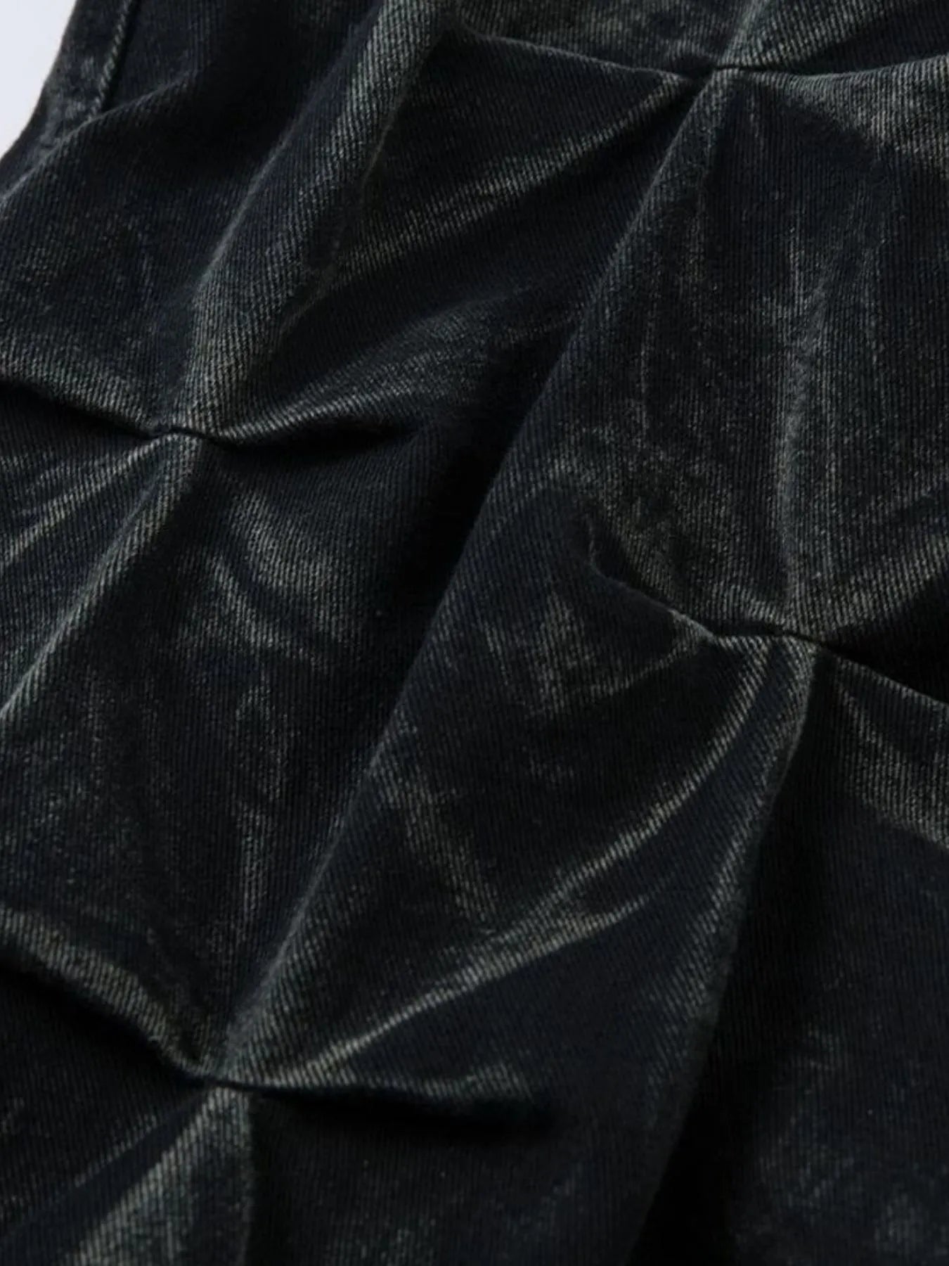 Men's black wide leg jeans with ruched detail, stylish denim from Trendsi, shown on a model.