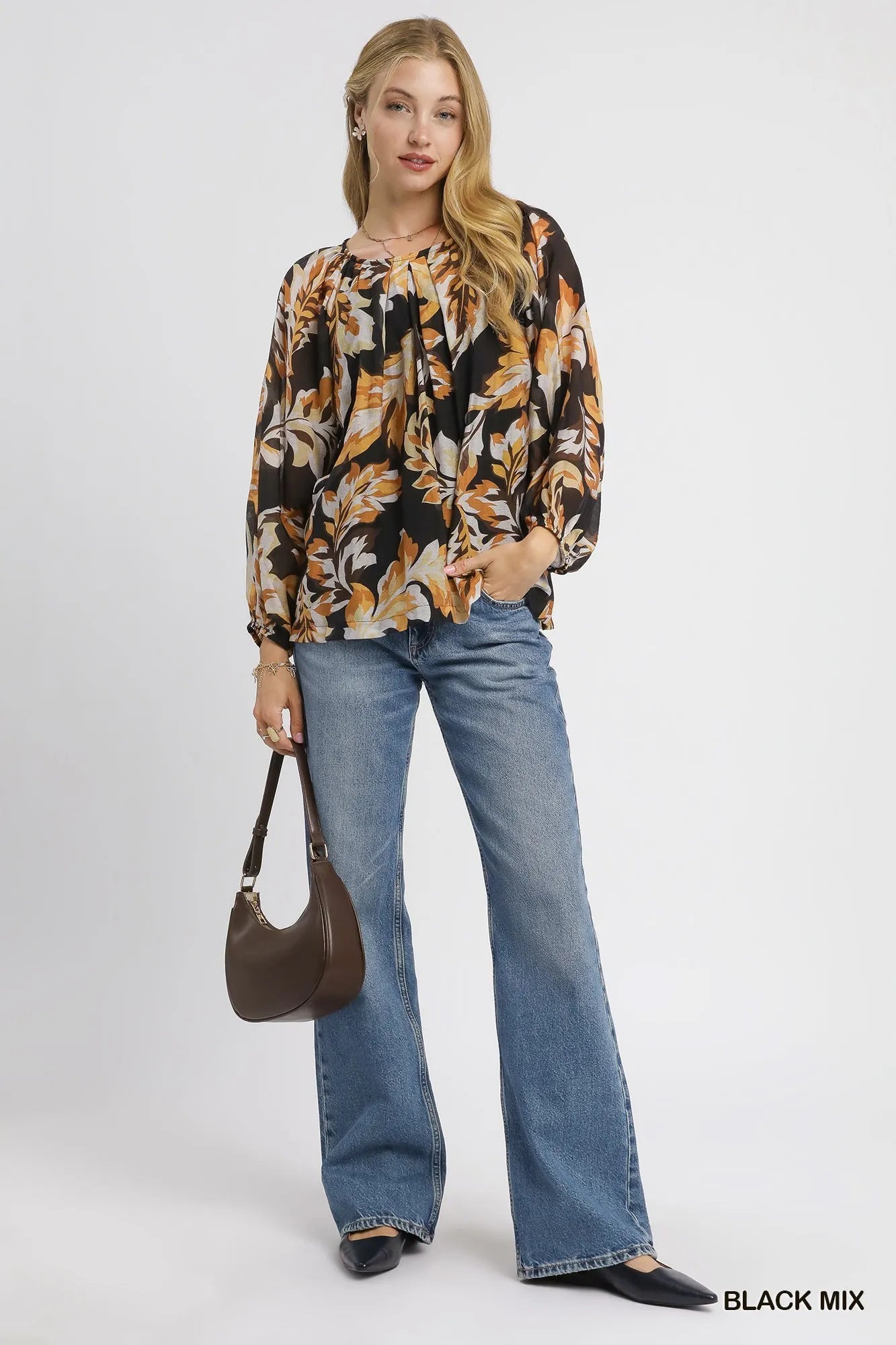 Black Umgee balloon sleeve blouse with autumn leaf print and relaxed fit, featuring stylish balloon sleeves.