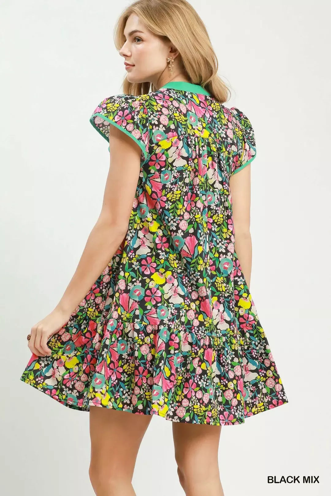 Black floral Umgee tiered mini dress with flutter sleeves, featuring a feminine, tiered design and lightweight fabric.