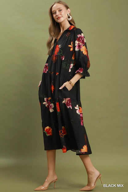 Black floral print tiered midi dress with puff sleeves by Umgee, featuring a feminine and flowy design.
