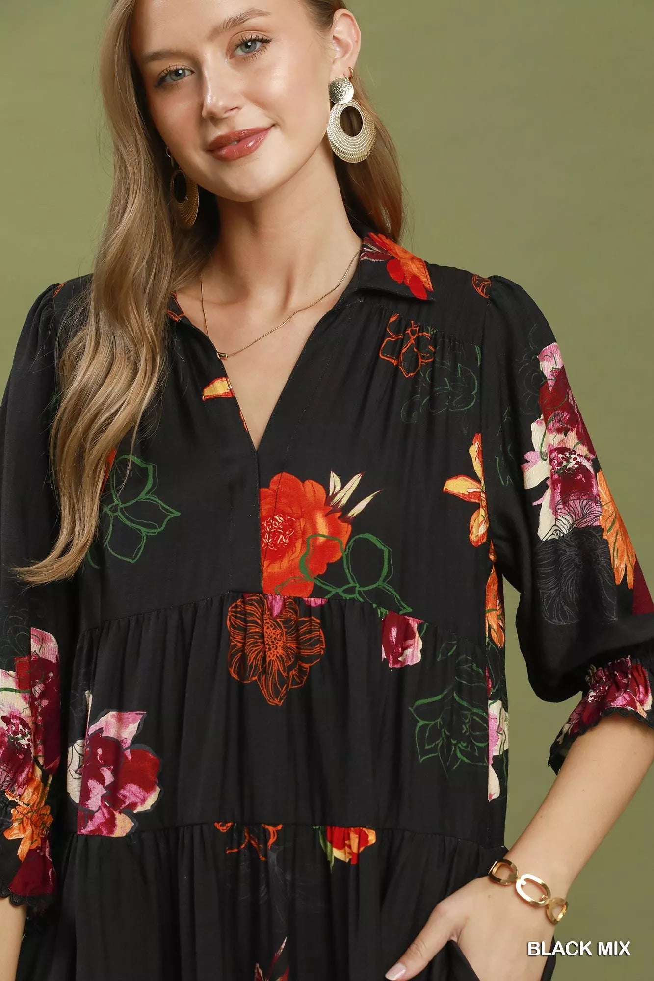 Black floral print tiered midi dress with puff sleeves from Umgee, featuring a feminine, flowing silhouette and vibrant floral pattern.